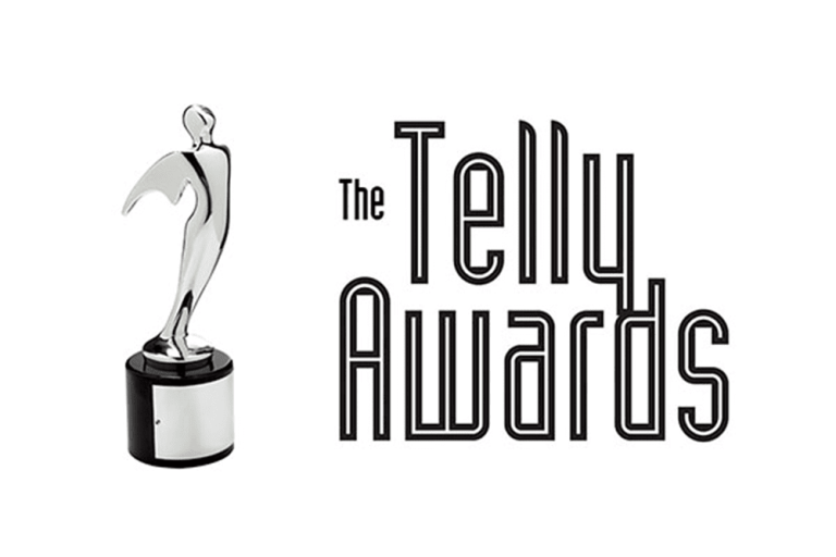 A silver Telly Award trophy stands next to the text "The Telly Awards" in bold, stylized font on a white background.