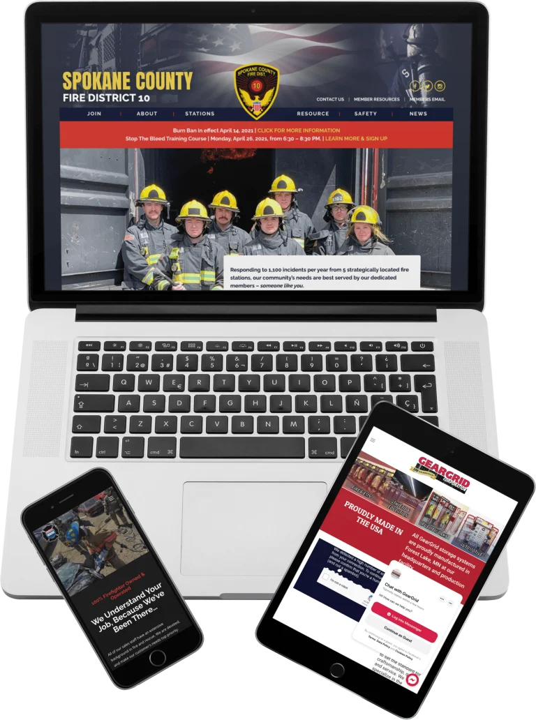 A laptop, tablet, and smartphone display different emergency service websites. The laptop shows Spokane County Fire District 10’s site with firefighters, while the other devices show emergency-related web pages.