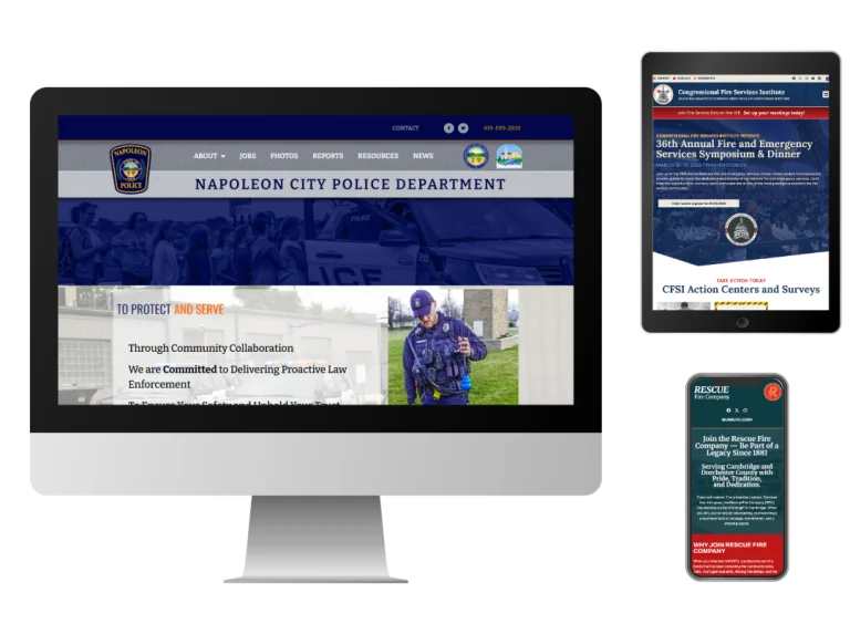 A desktop monitor, tablet, and smartphone display different public safety websites: a police department page on the monitor, a fire services event page on the tablet, and a rescue information page on the phone.