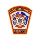 Patch-shaped Goochland Fire-Rescue emblem with "GOOCHLAND" at the top, symbols of flags, emergency icons, and "Goochland County, Virginia 1727" crest in the center. "FIRE-RESCUE" written at the bottom.